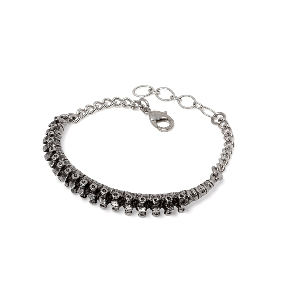Silver spine inspired bracelet on a white background