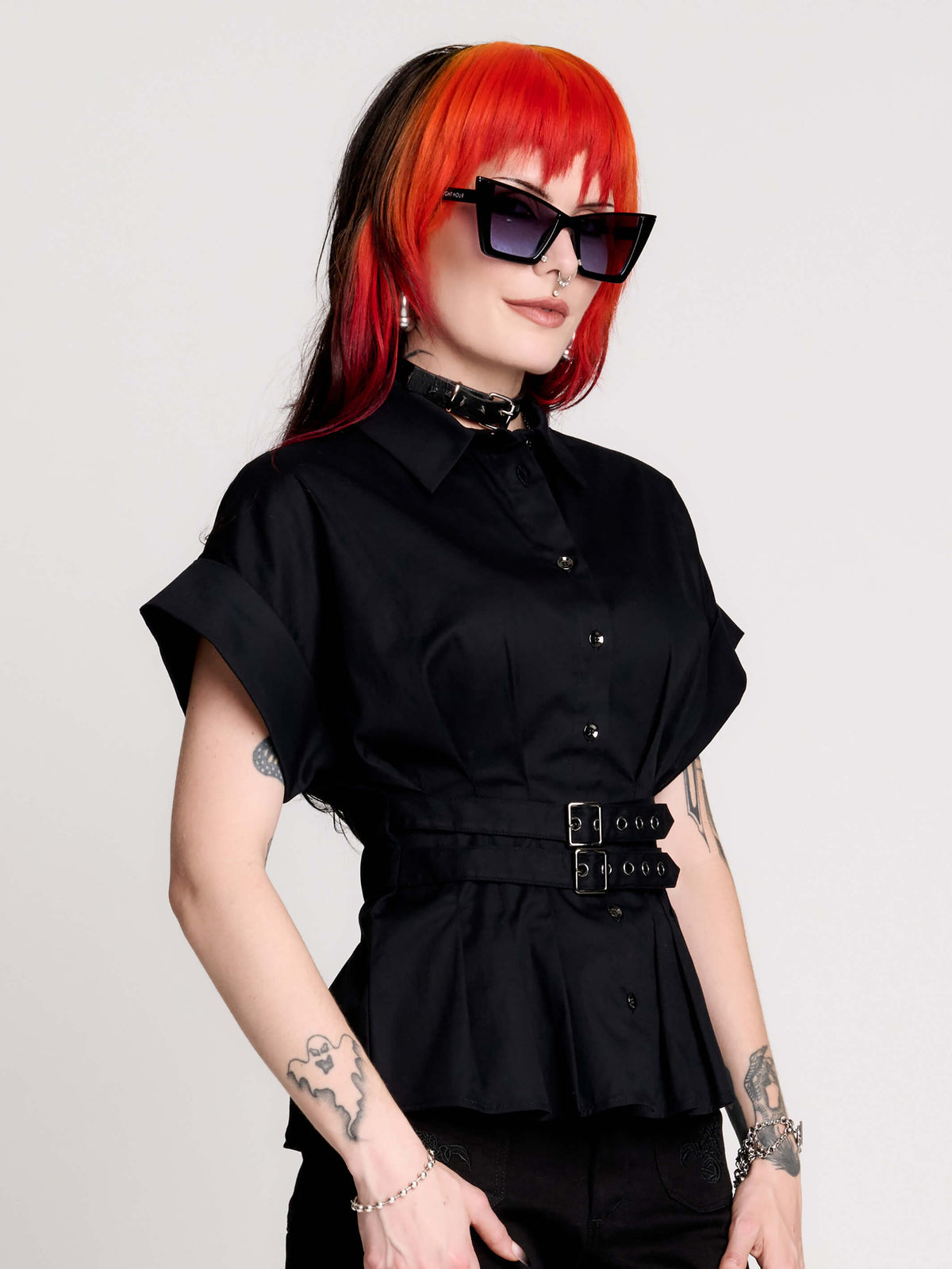 a black short-sleeve button-front shirt dress with a matching double-buckle front waist details.