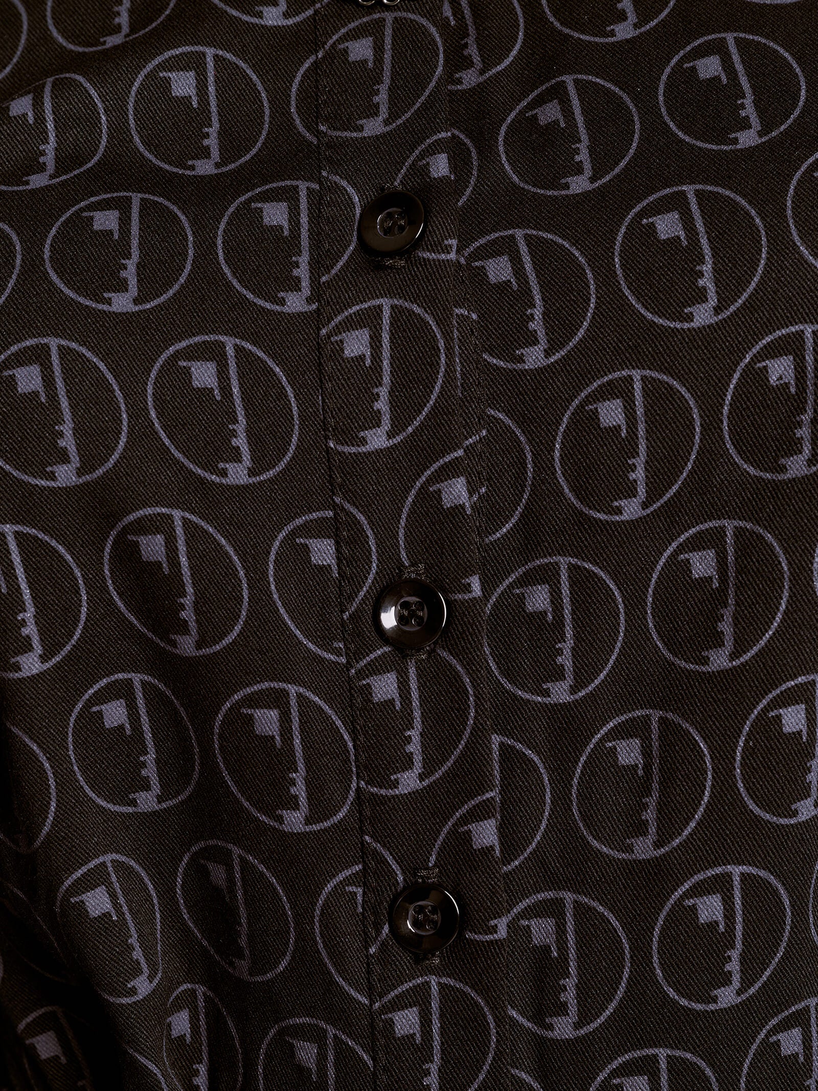 Close-up of a shirt with a geometric pattern on a black background