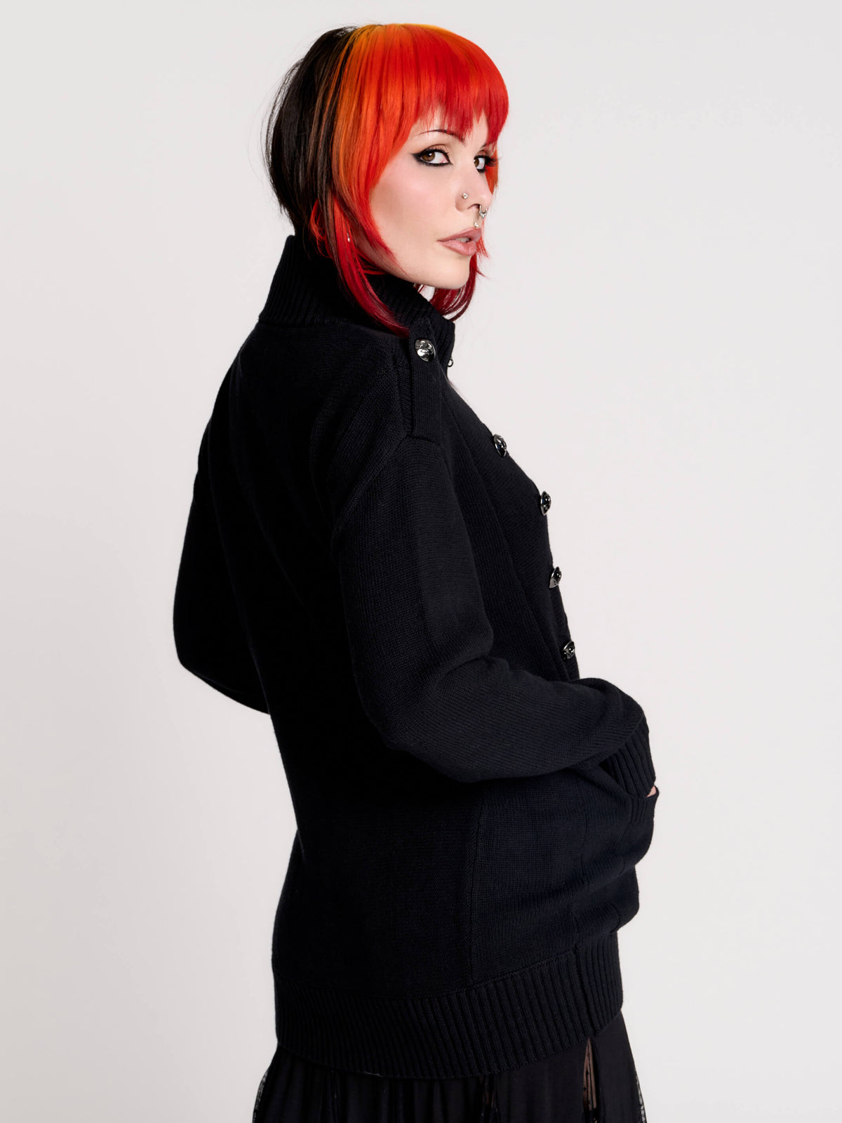 black zip-up knitted cardigan with ilver tones buttons and pockets