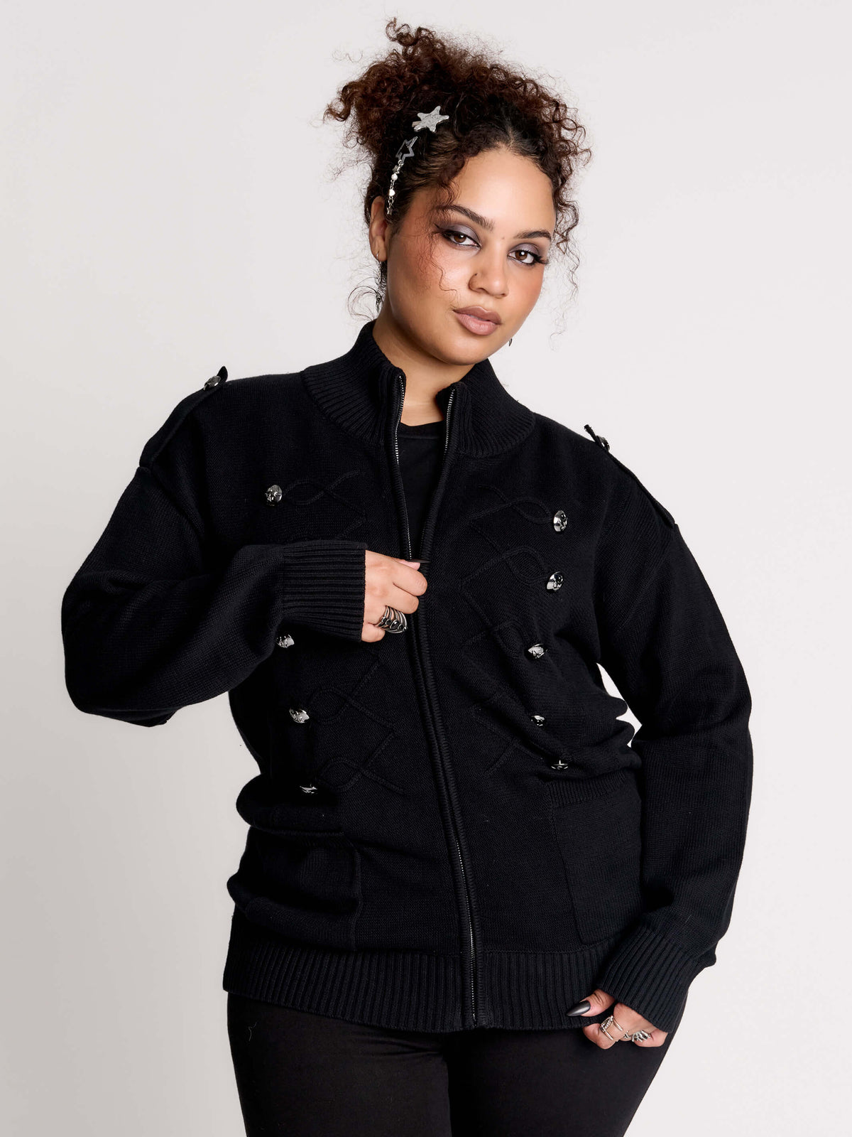 black zip-up knitted cardigan with ilver tones buttons and pockets