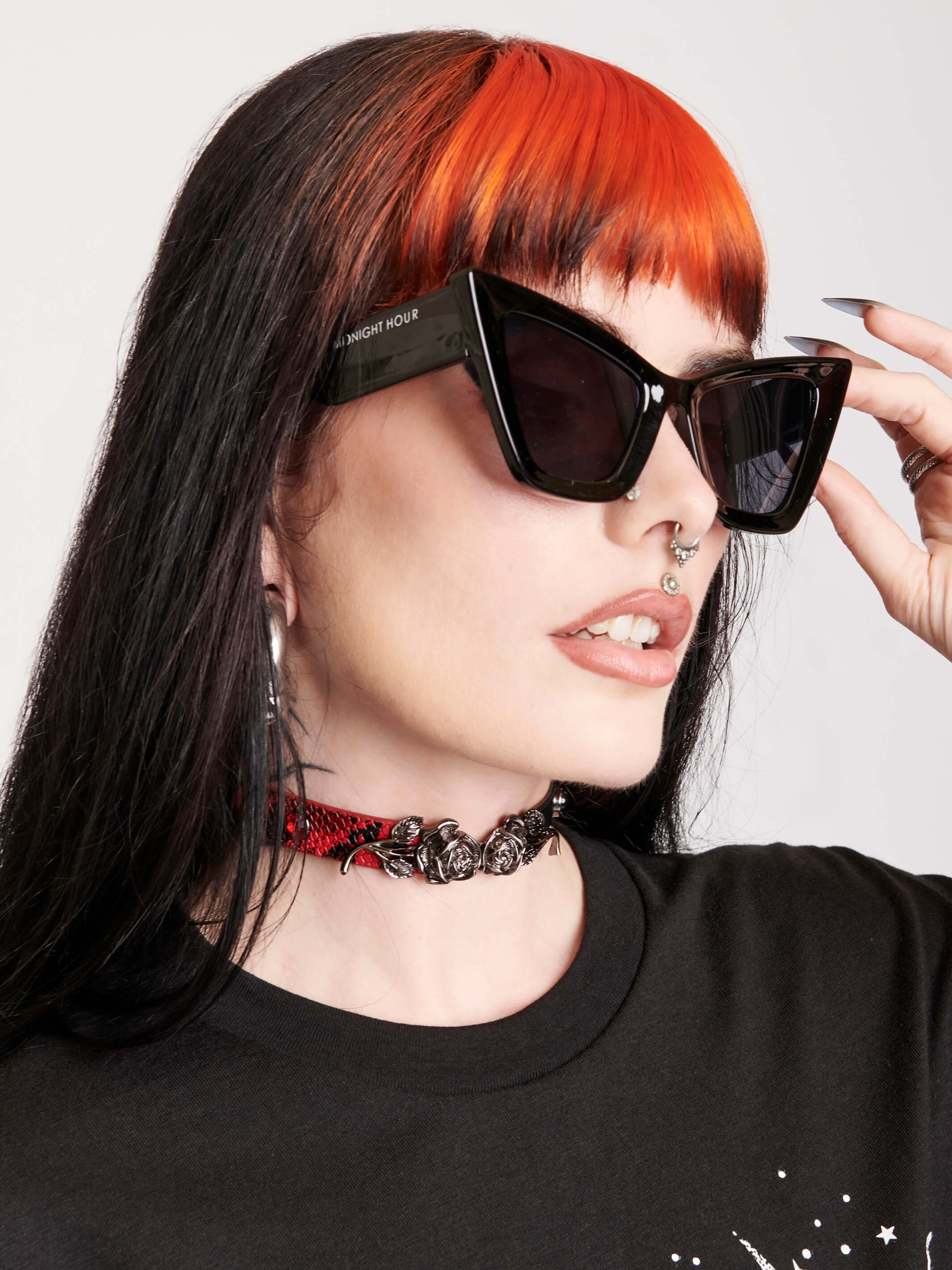 Black cat eye sunglasses with midnight hour logo