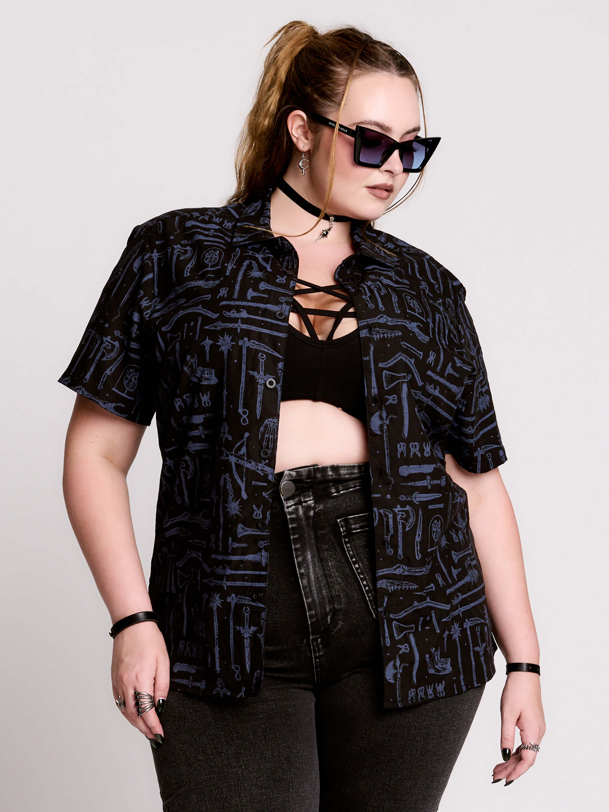 short-sleeve button-down that mixes crisp classic shirting with dark, gothic illustration.