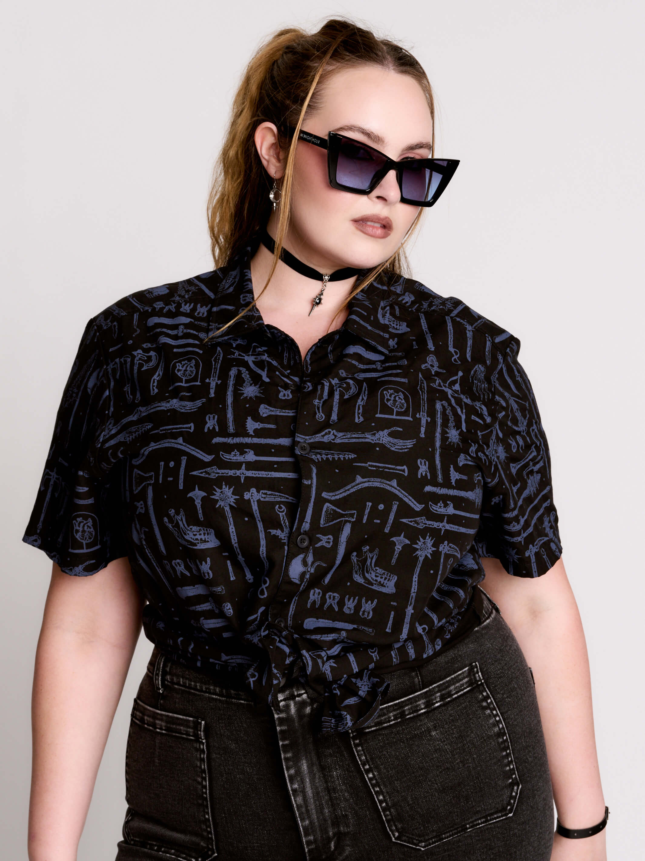 short-sleeve button-down that mixes crisp classic shirting with dark, gothic illustration.