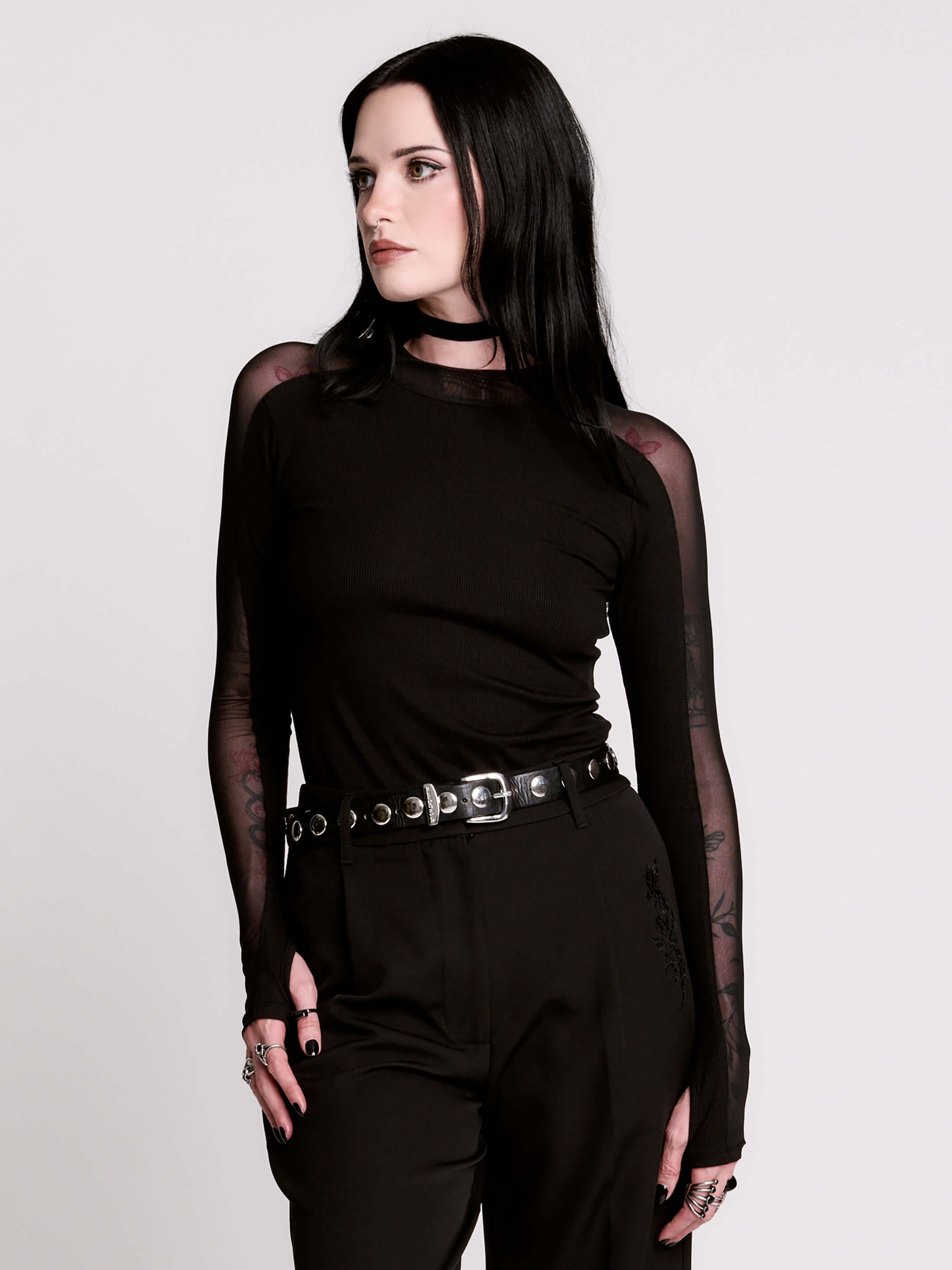 black long-sleeve top with sheer mesh sleeves