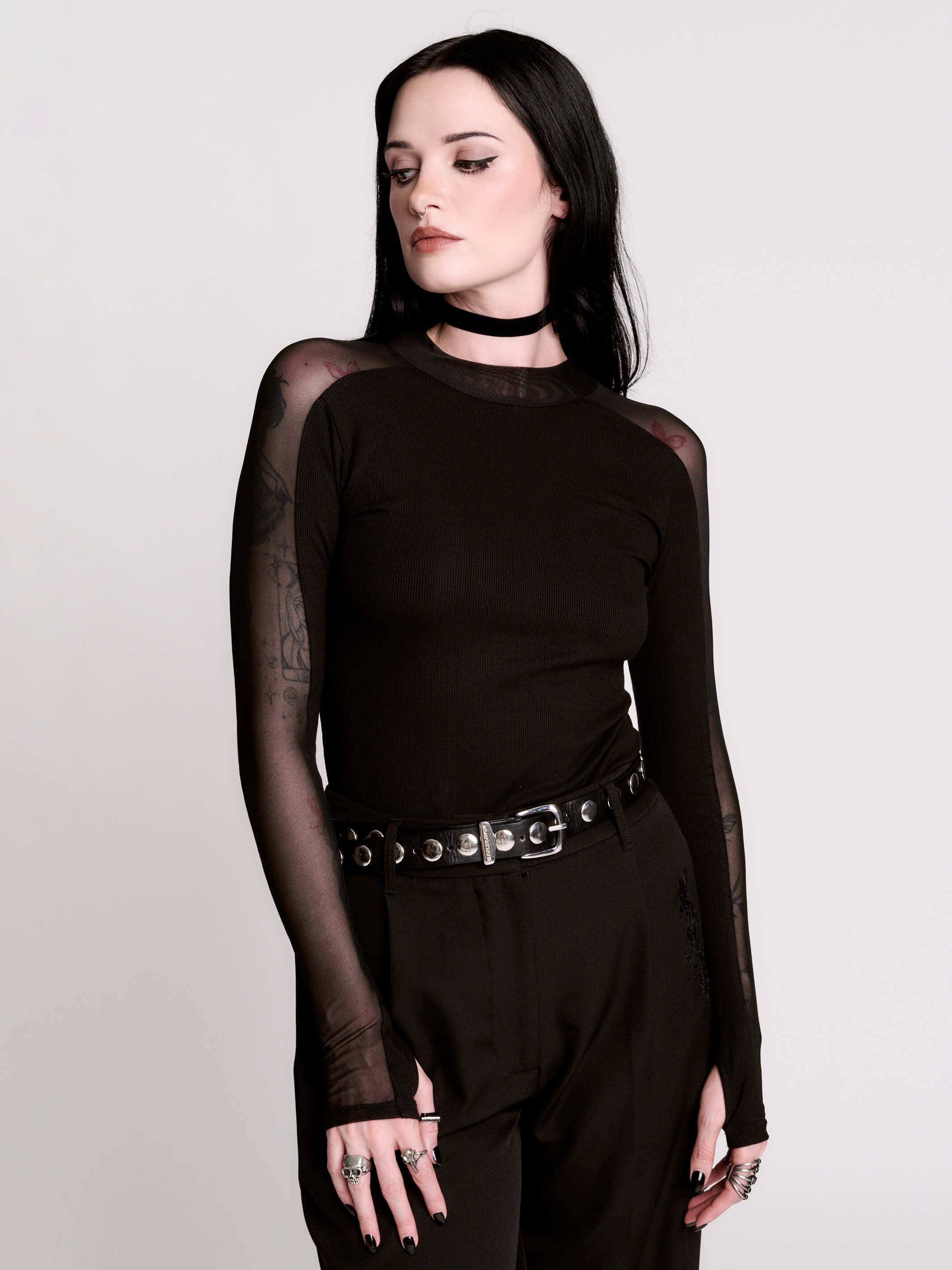 black long-sleeve top with sheer mesh sleeves