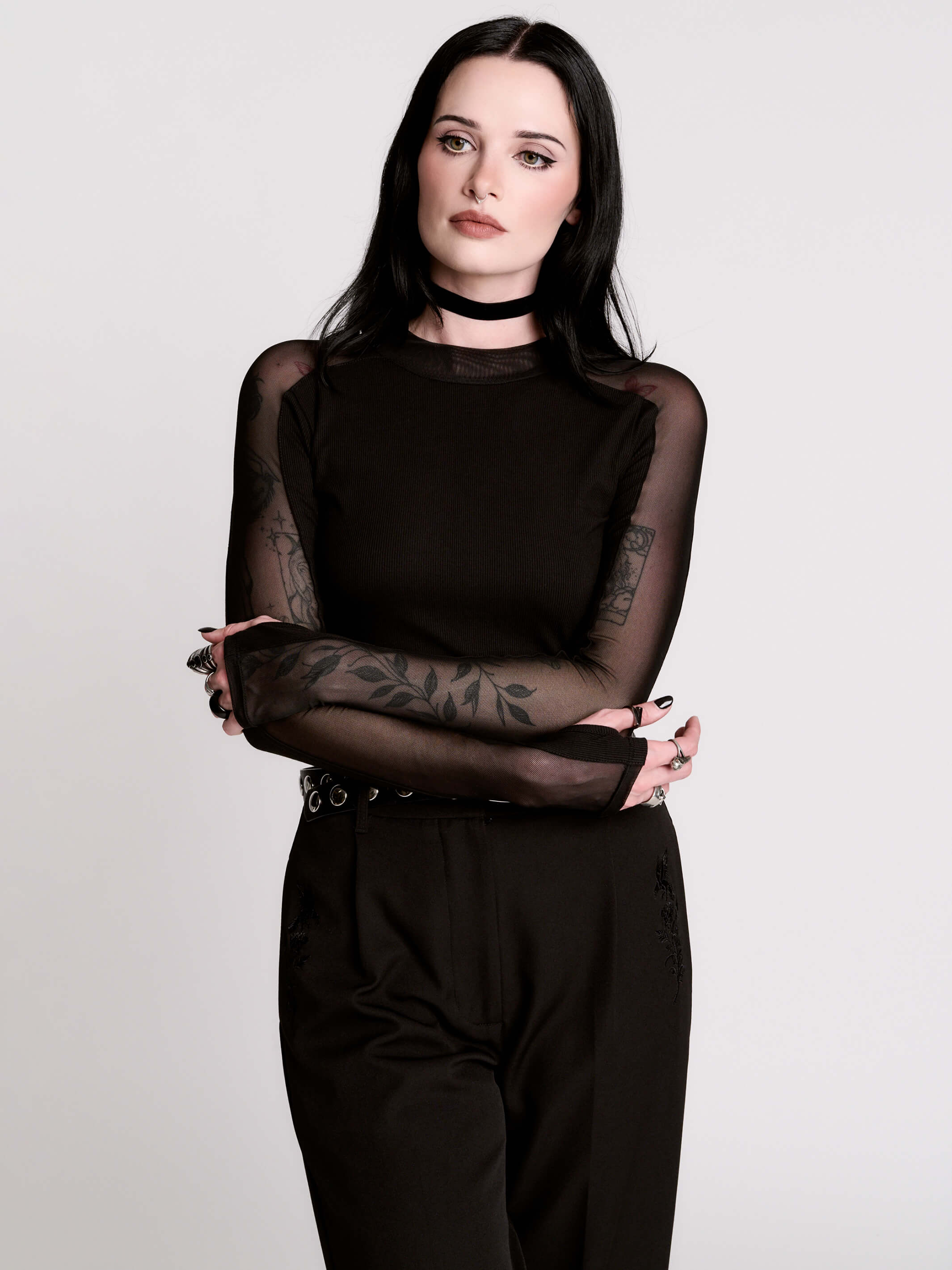 black long-sleeve top with sheer mesh sleeves