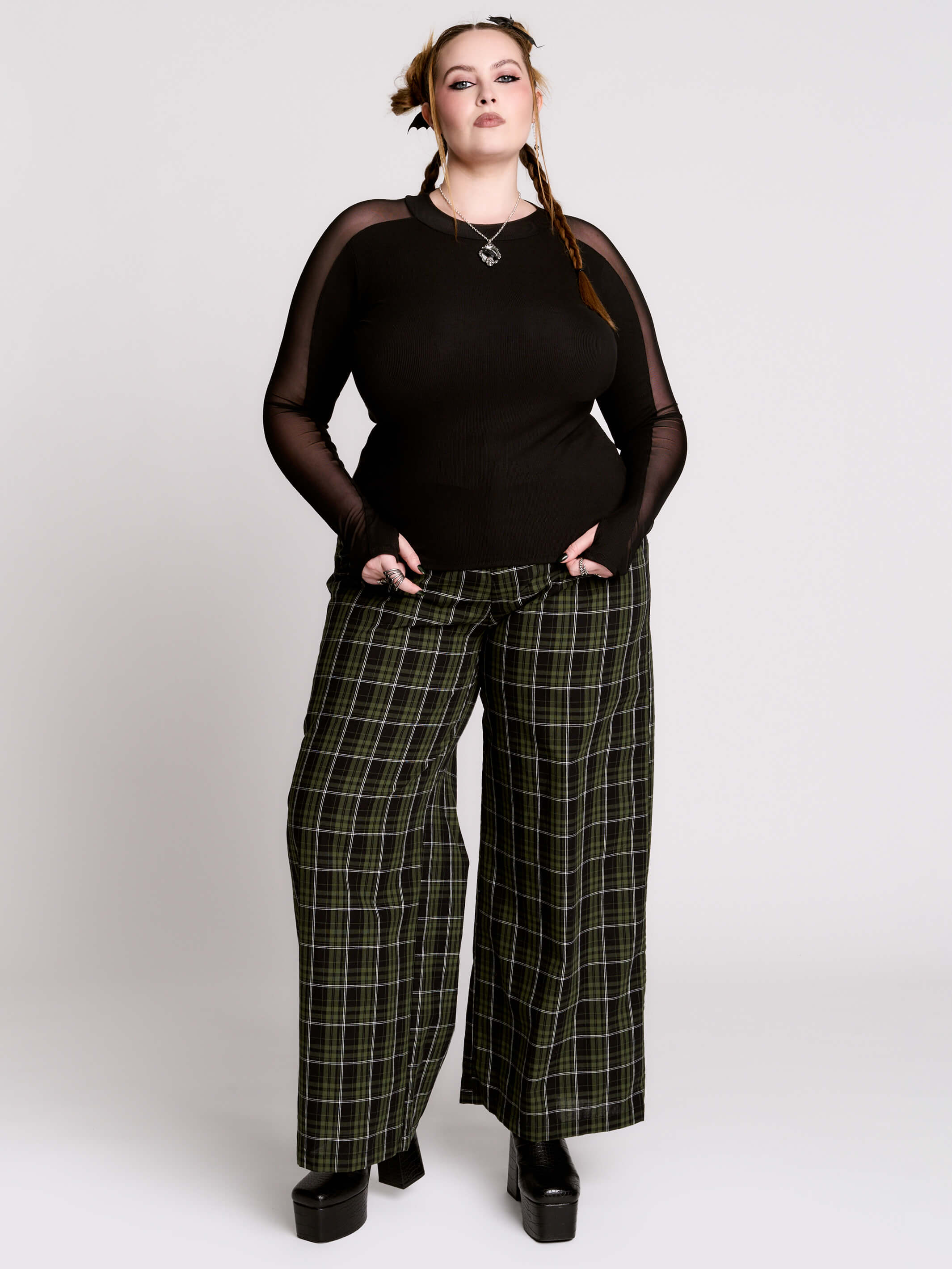 black long-sleeve top with sheer mesh sleeves