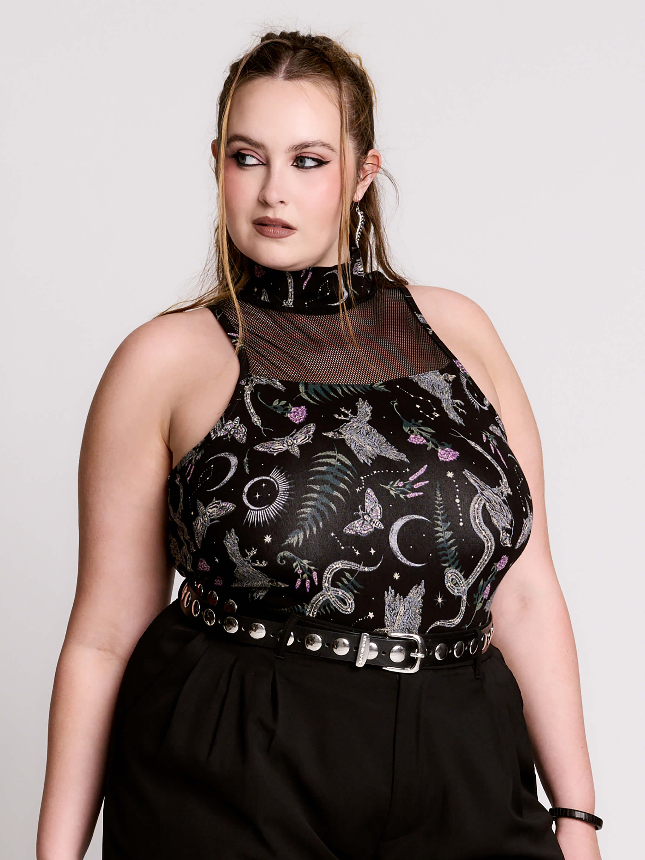 A black sleeveless top with a high mesh neck and an allover gothic-style print featuring silver snakes, moths, ravens and small pink floral accents.