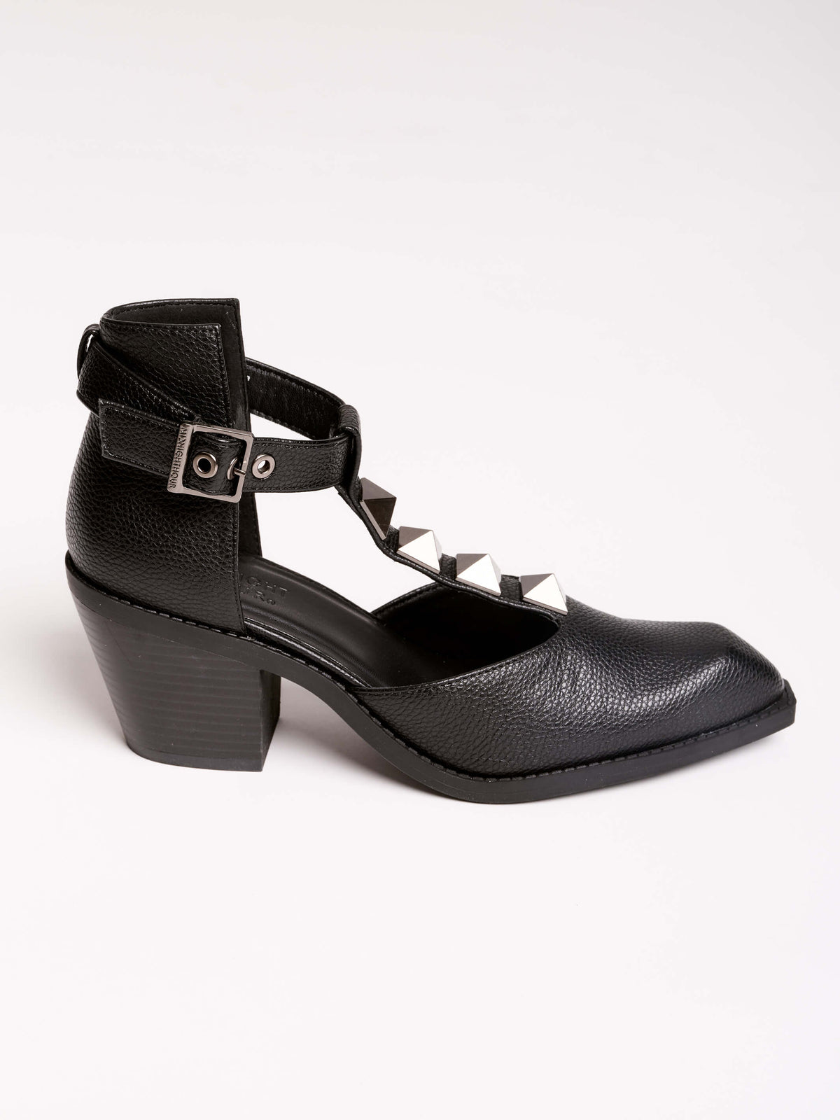 A pair of black leather ankle-strap block-heel shoes with pointed toes and silver pyramid stud embellishments.
