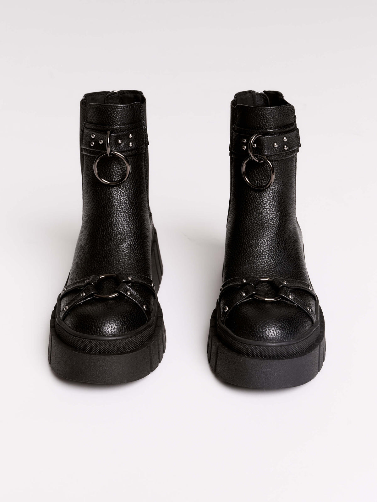 Black chunky platform ankle boots with buckle straps.
