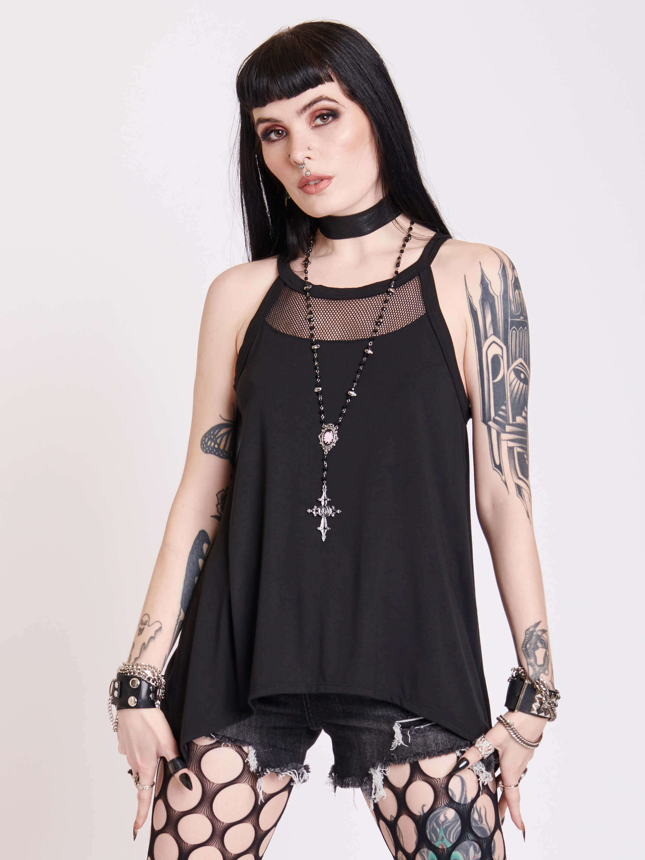 black tank with sheer back panel embroidered with spine motif