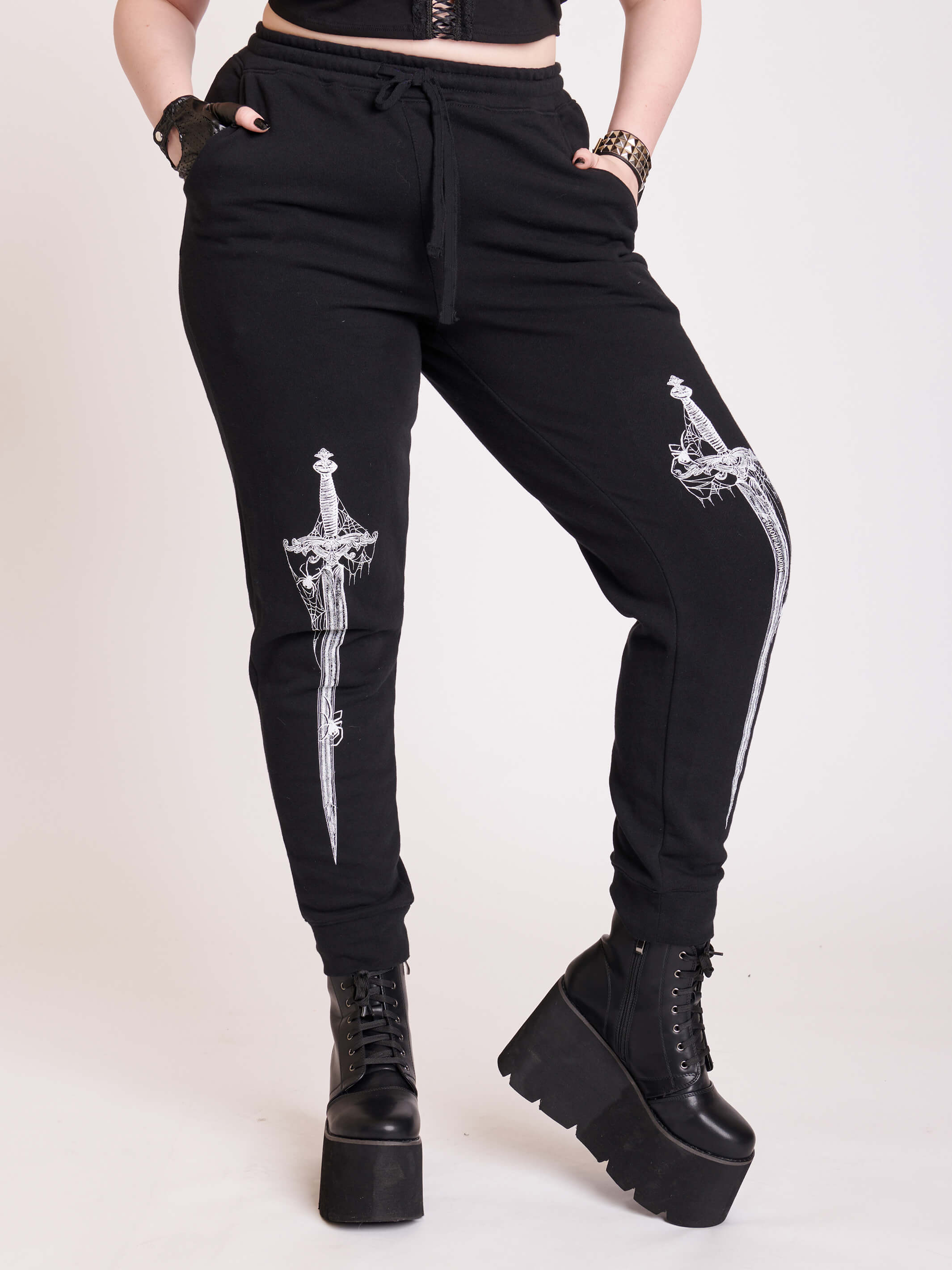 black joggers with dagger graphic
