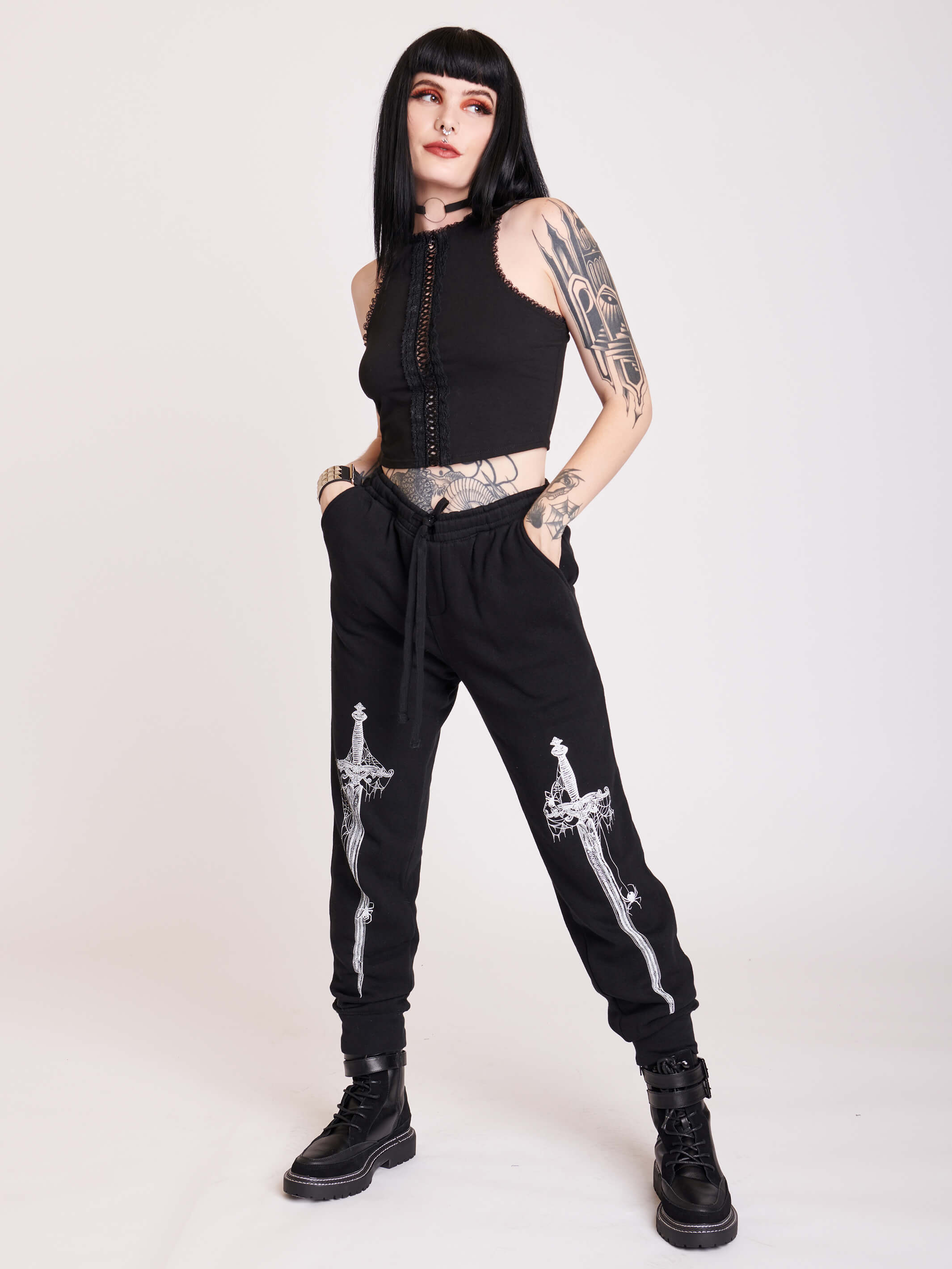 black joggers with dagger graphic