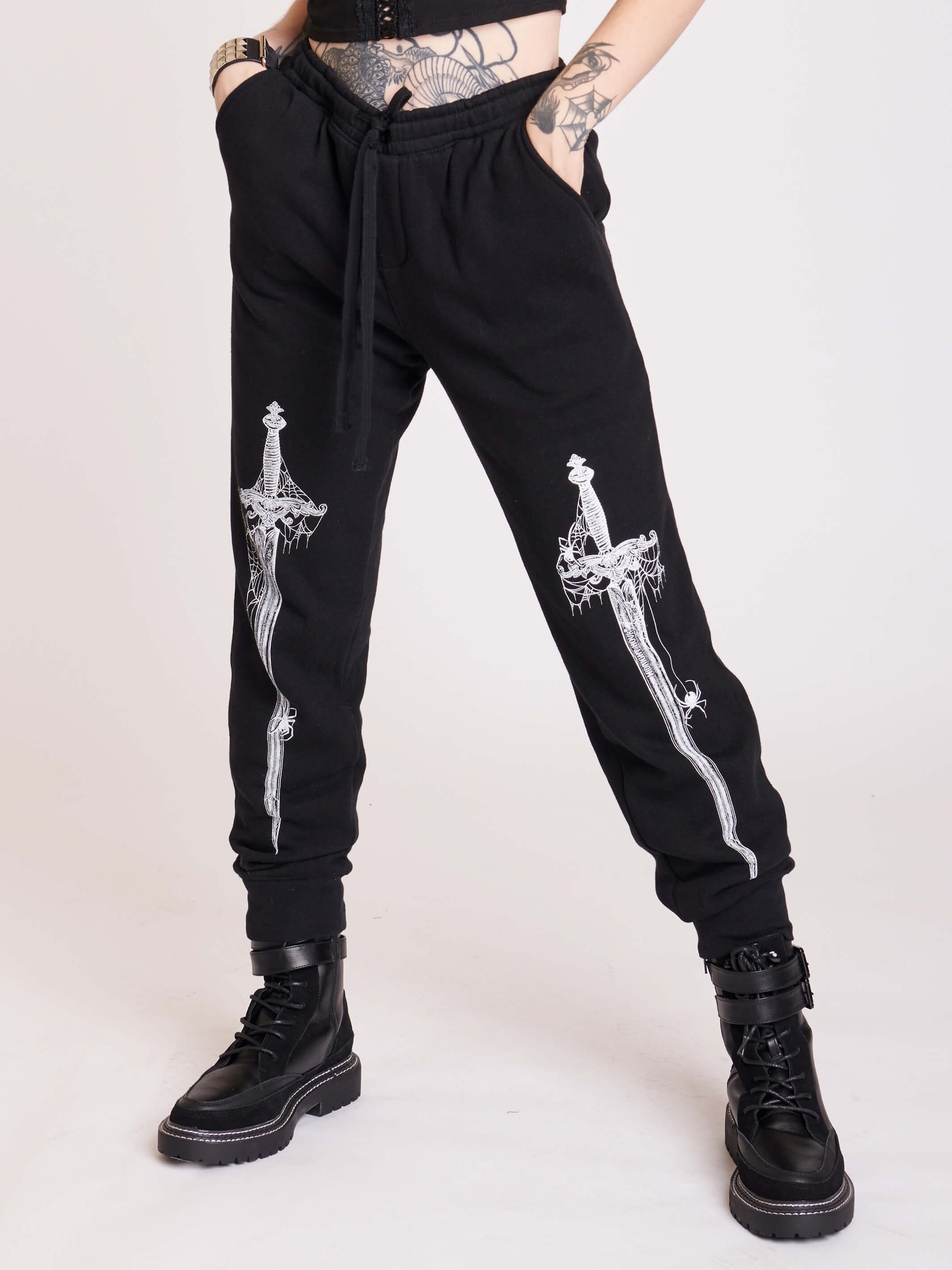 black joggers with dagger graphic