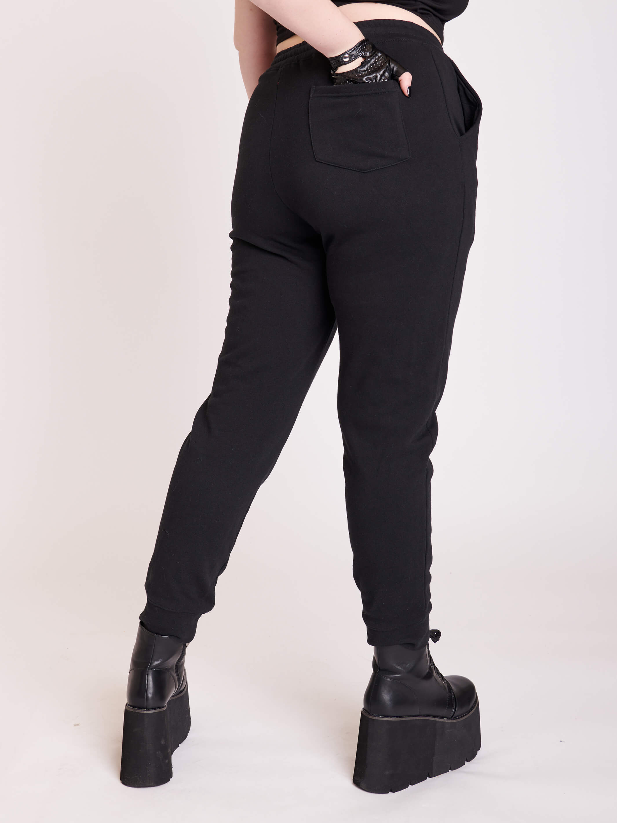 black joggers with dagger graphic