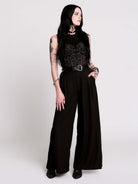A black sleeveless top with a printed floral lace corset in light grey.