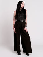 A black sleeveless top with a printed floral lace corset in light grey.
