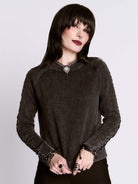 distressed braided sweater
