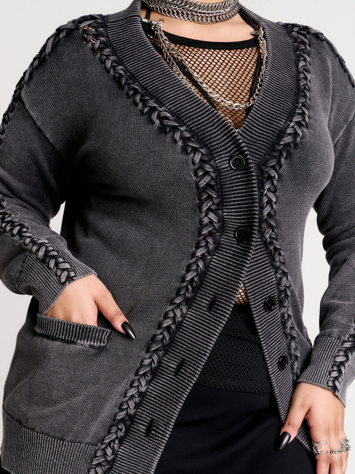 a dark gray textured cardigan with braided details