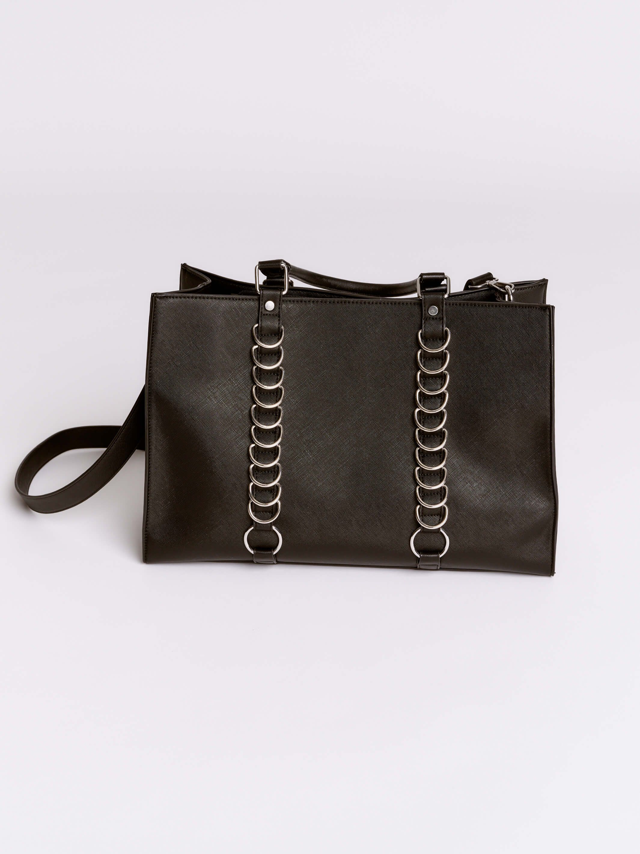 Black handbag with chain details on a light gray background