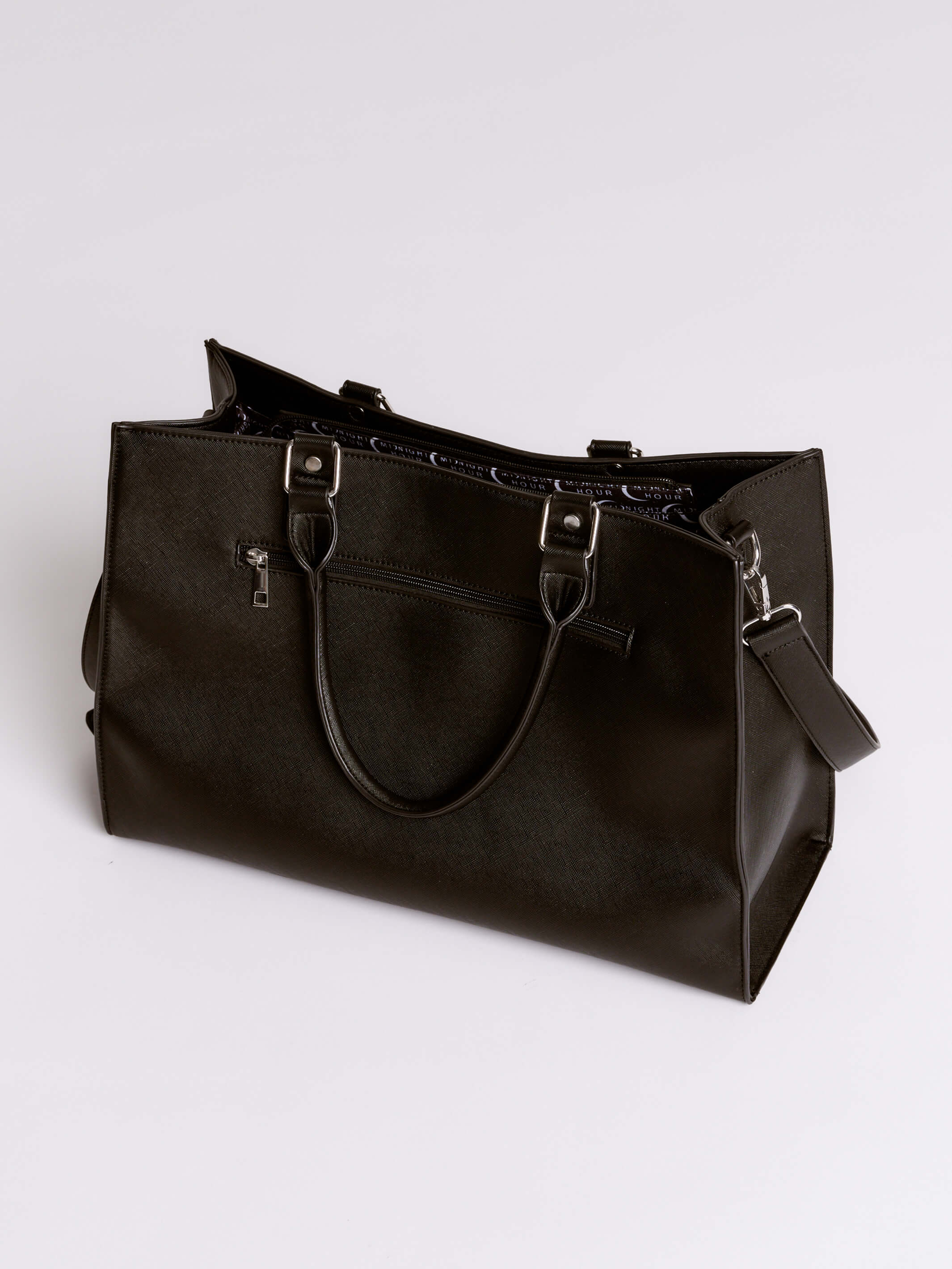 Black leather handbag on a light gray background