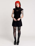 a black sheer mock-neck top with a black graphic on the chest