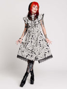 black and white gothic-style dress with a bird pattern, lace trim, and a high ruffled collar