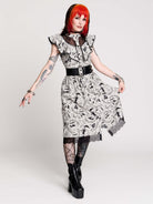 black and white gothic-style dress with a bird pattern, lace trim, and a high ruffled collar