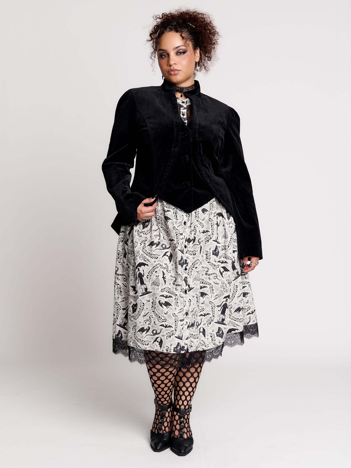 black velvet jacket with a black-and-white patterned lining