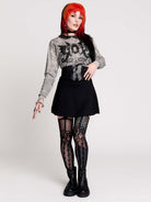 gray marled long-sleeve shirt with a black dragon graphic and a printed Peter Pan collar