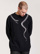 sweater with skeleton snake detail around neck.