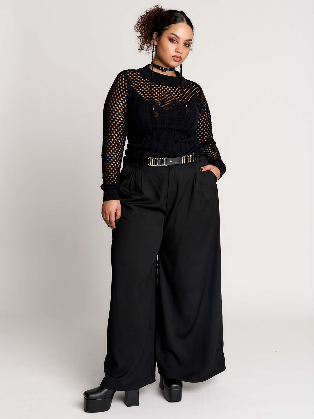 Fishnet Sweetheart Rib Sweater, a black long-sleeve top with a fitted rib-knit body and fishnet across the upper chest, shoulders, upper back and sleeves, giving a  “sweetheart” illusion while keeping the sleek silhouette sleek.