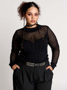 Fishnet Sweetheart Rib Sweater, a black long-sleeve top with a fitted rib-knit body and fishnet across the upper chest, shoulders, upper back and sleeves, giving a  “sweetheart” illusion while keeping the sleek silhouette sleek.
