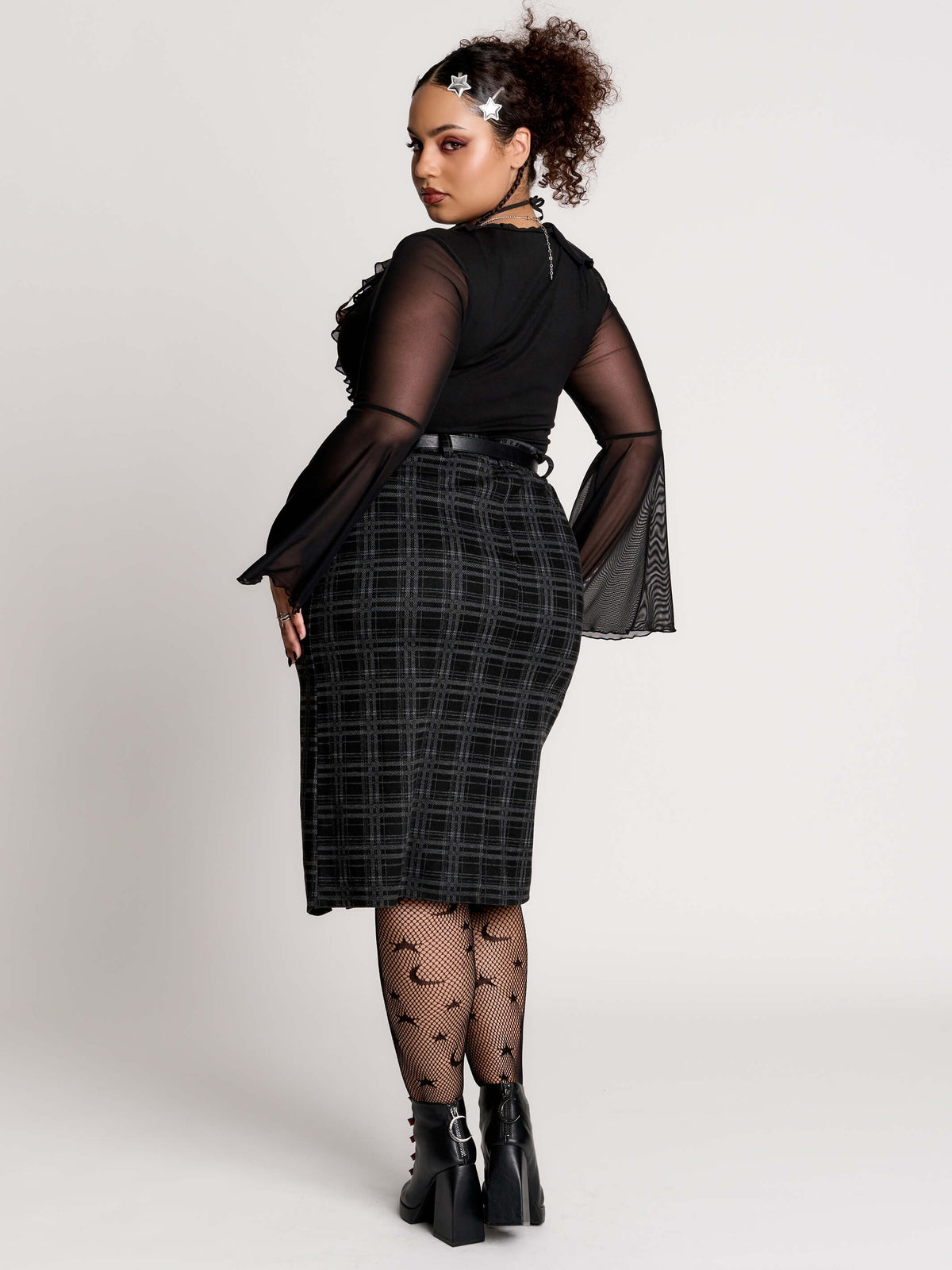  a black and gray plaid midi skirt with a front slit, 
