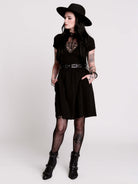 A black short-sleeve dress with a lace V-neckline.