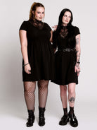A black short-sleeve dress with a lace V-neckline.
