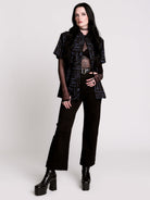 short-sleeve button-down that mixes crisp classic shirting with dark, gothic illustration. 