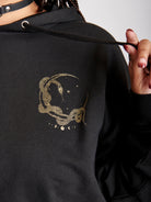 Black hoodie with gold moon tarot card graphic