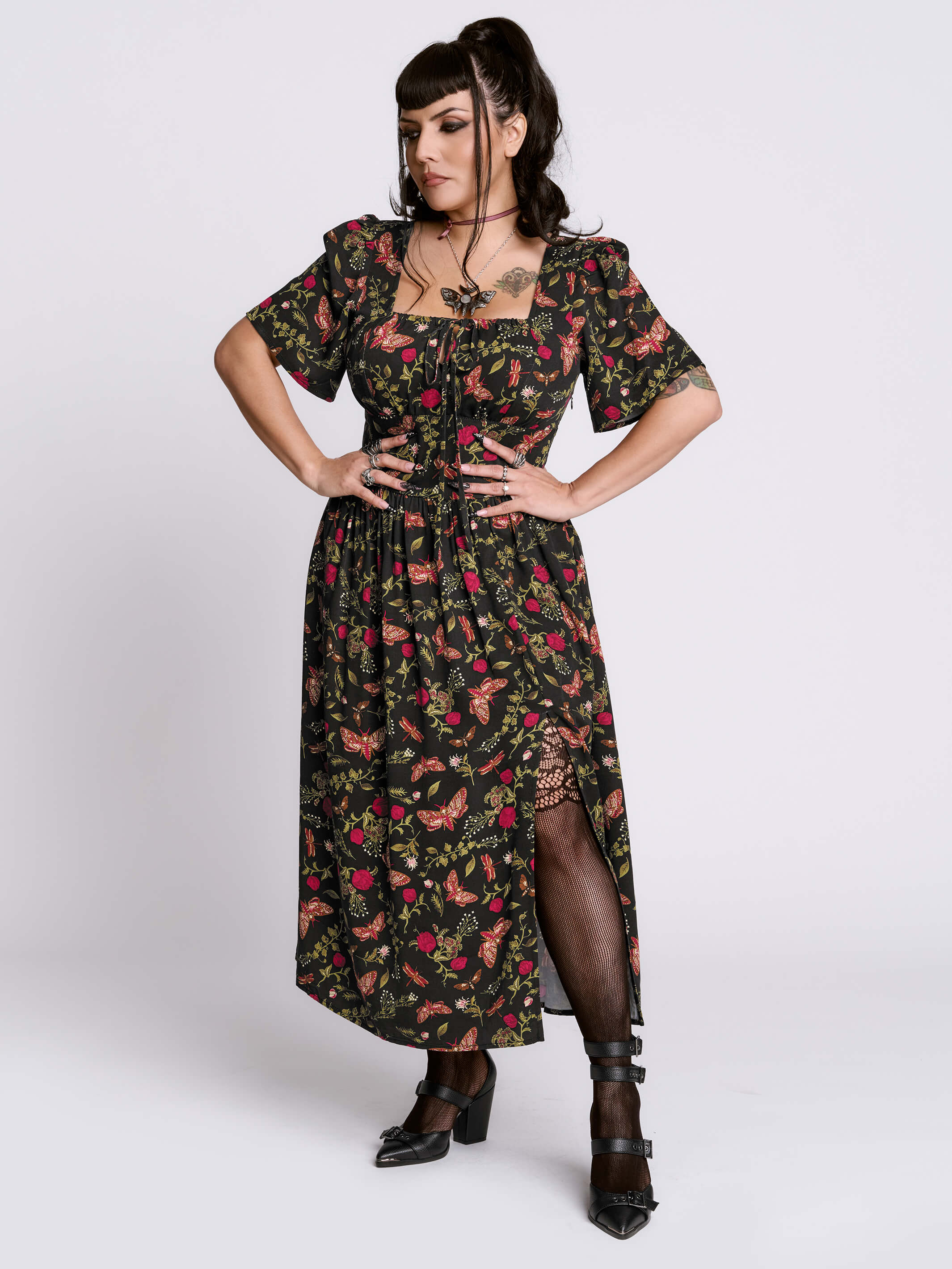 Woman wearing a floral dress with a white background