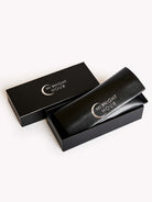 Black cosmetic bag with 'Midnight Hour' logo on a white background