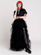 a voluminous layered black tulle skirt. 
