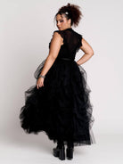 a voluminous layered black tulle skirt. 