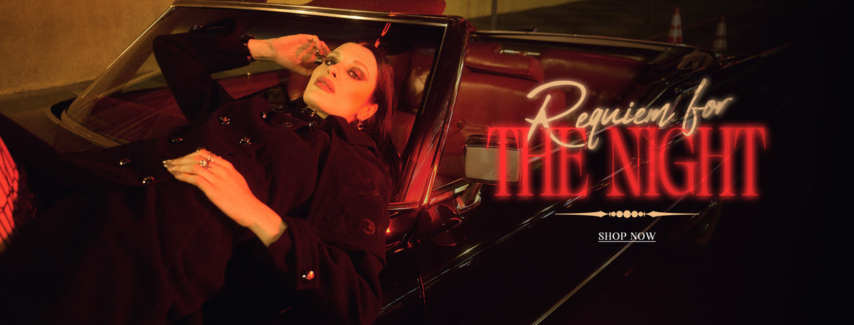 A woman reclining inside a dark convertible car at night under dramatic red lighting, with the text 'Requiem for THE NIGHT' and 'SHOP NOW' overlaid on the right side.