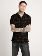 A black short-sleeve button-up shirt with  repeating red and green scarab beetle pattern.