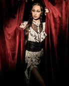 black and white gothic-style dress with a bird pattern, lace trim, and a high ruffled collar