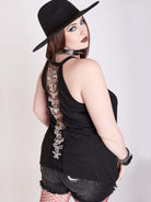 black tank with sheer back panel embroidered with spine motif