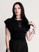  short sleeve top with a softly draped silhouette and a flattering, cinched waist. 