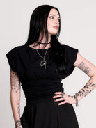 short sleeve top with a softly draped silhouette and a flattering, cinched waist. 