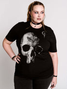 A black t-shirt with a large white skull graphic on the front.